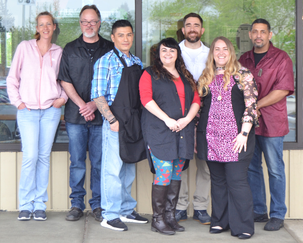 A group photo of all of the barbers.